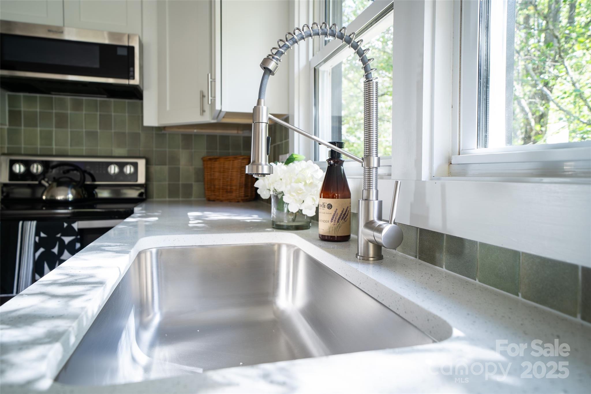 300 Pisgah View Road Asheville, NC 28806 - Photo 12 of 29 a kitchen with a sink and a window