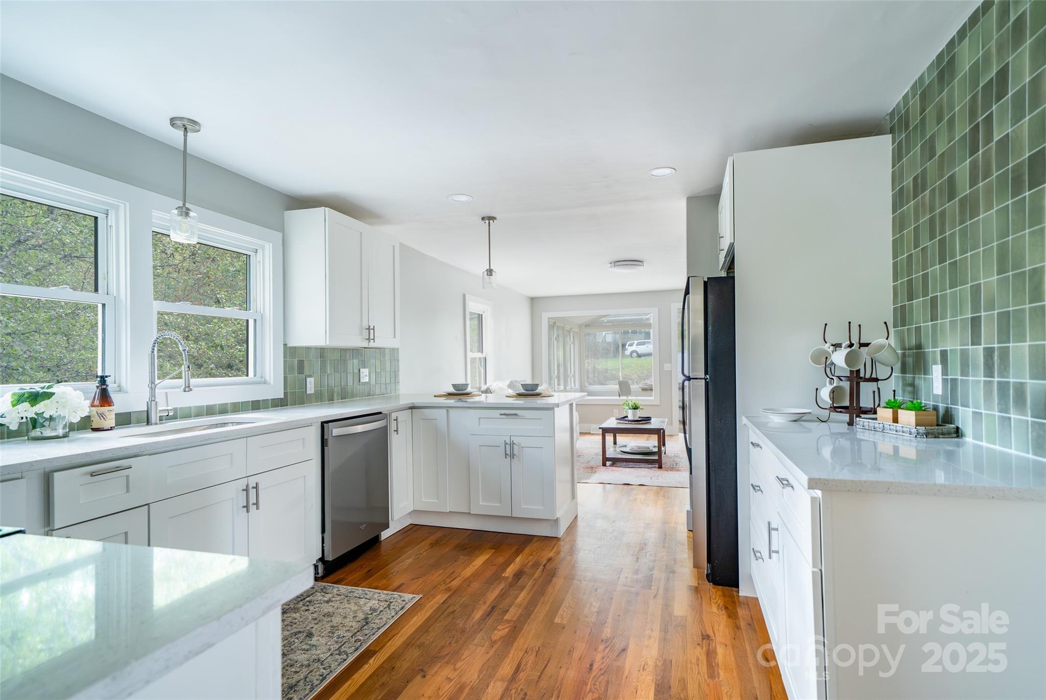 300 Pisgah View Road Asheville, NC 28806 - Photo 14 of 29 a kitchen with a sink stove and wooden floor