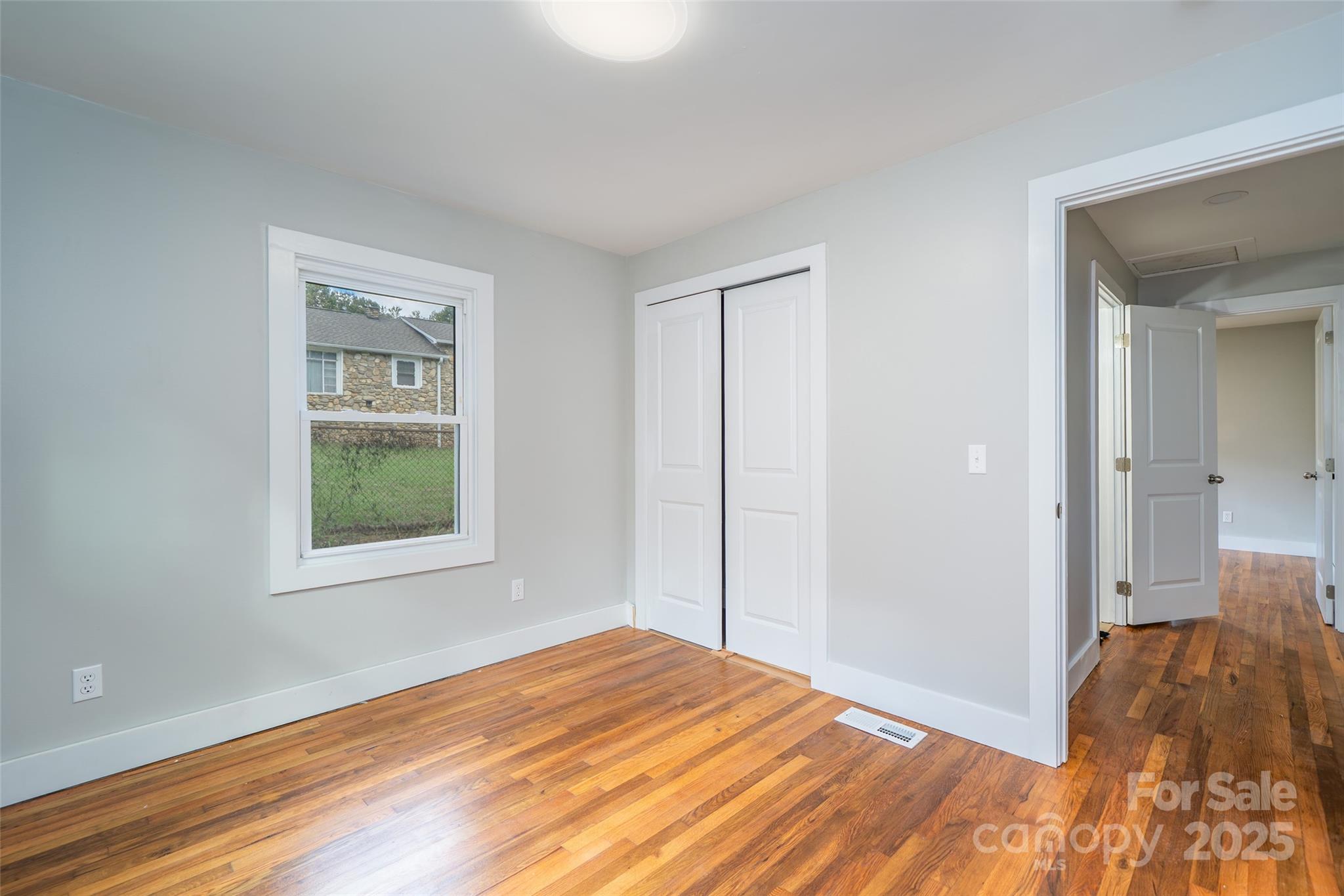 300 Pisgah View Road Asheville, NC 28806 - Photo 21 of 29 a view of empty room with wooden floor and fan