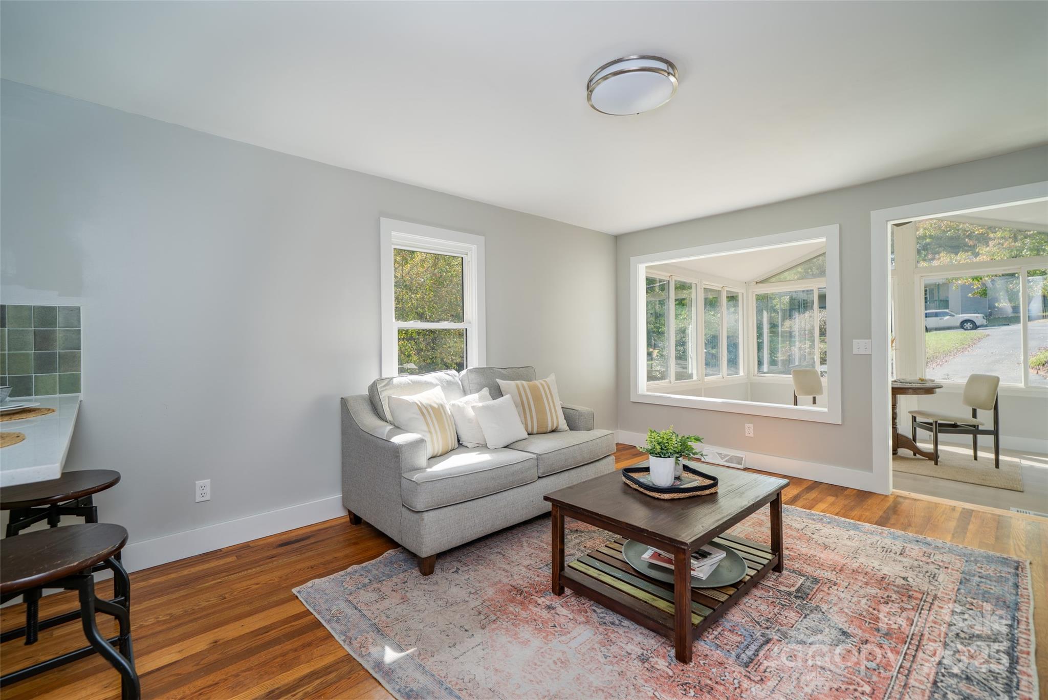300 Pisgah View Road Asheville, NC 28806 - Photo 7 of 29 a living room with furniture a rug and a window