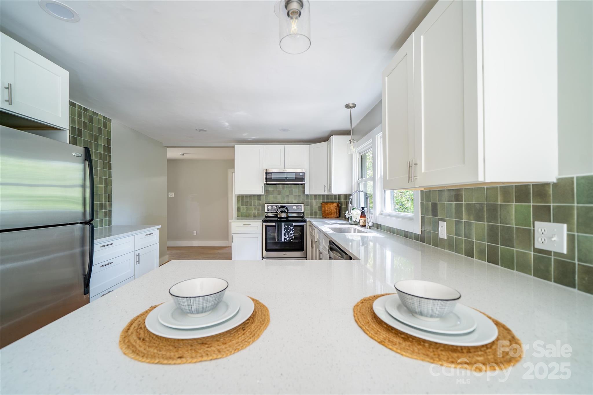 300 Pisgah View Road Asheville, NC 28806 - Photo 10 of 29 a kitchen with a appliances and a wooden floor
