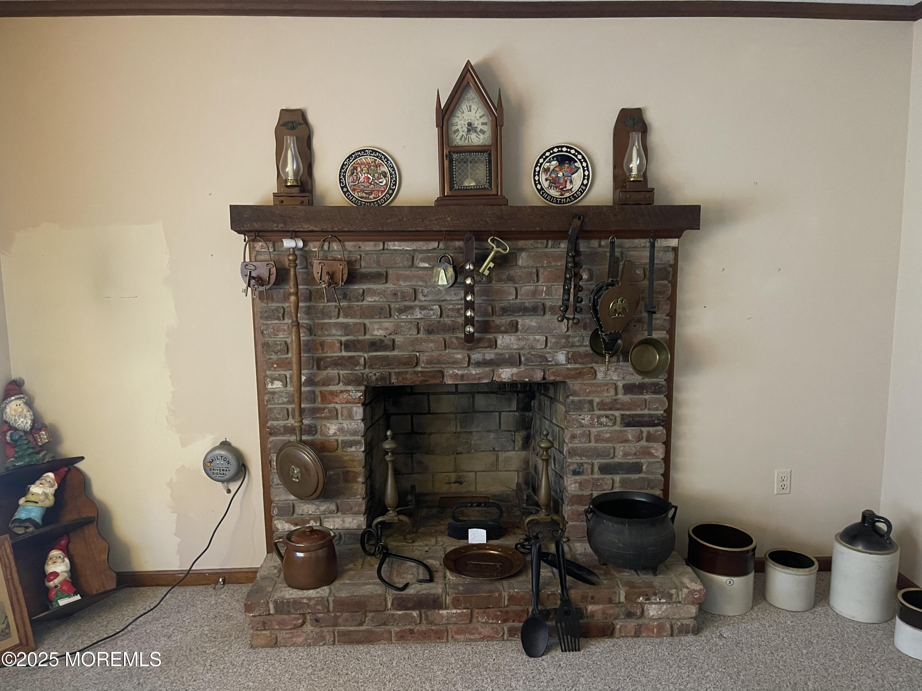 2023 Lanes Mill Road Brick, NJ 08724 - Photo 17 of 40 a front view of a fireplace with wooden wall