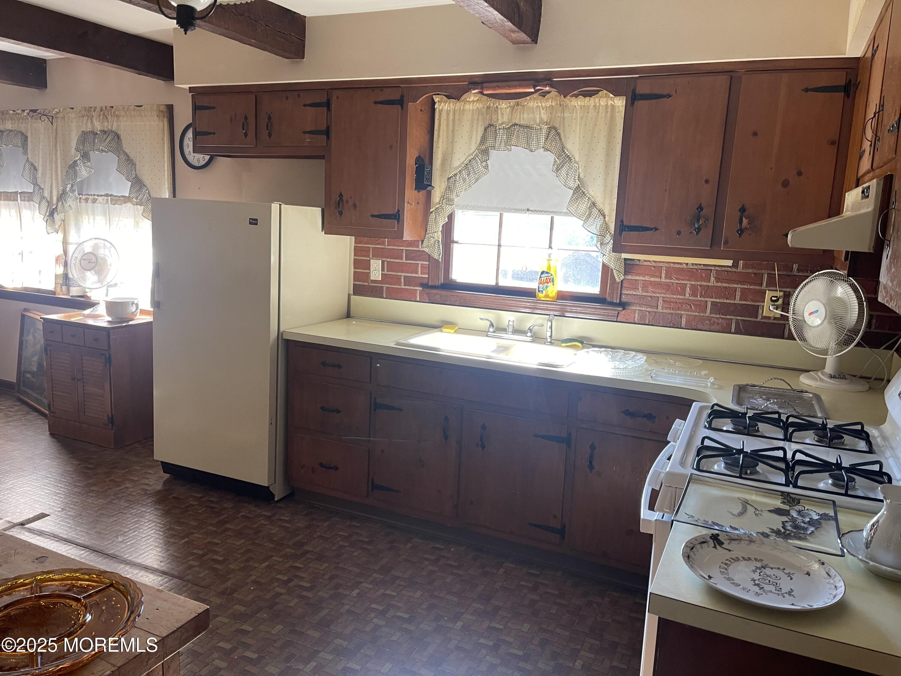 2023 Lanes Mill Road Brick, NJ 08724 - Photo 20 of 40 a kitchen with stainless steel appliances granite countertop a sink stove and refrigerator