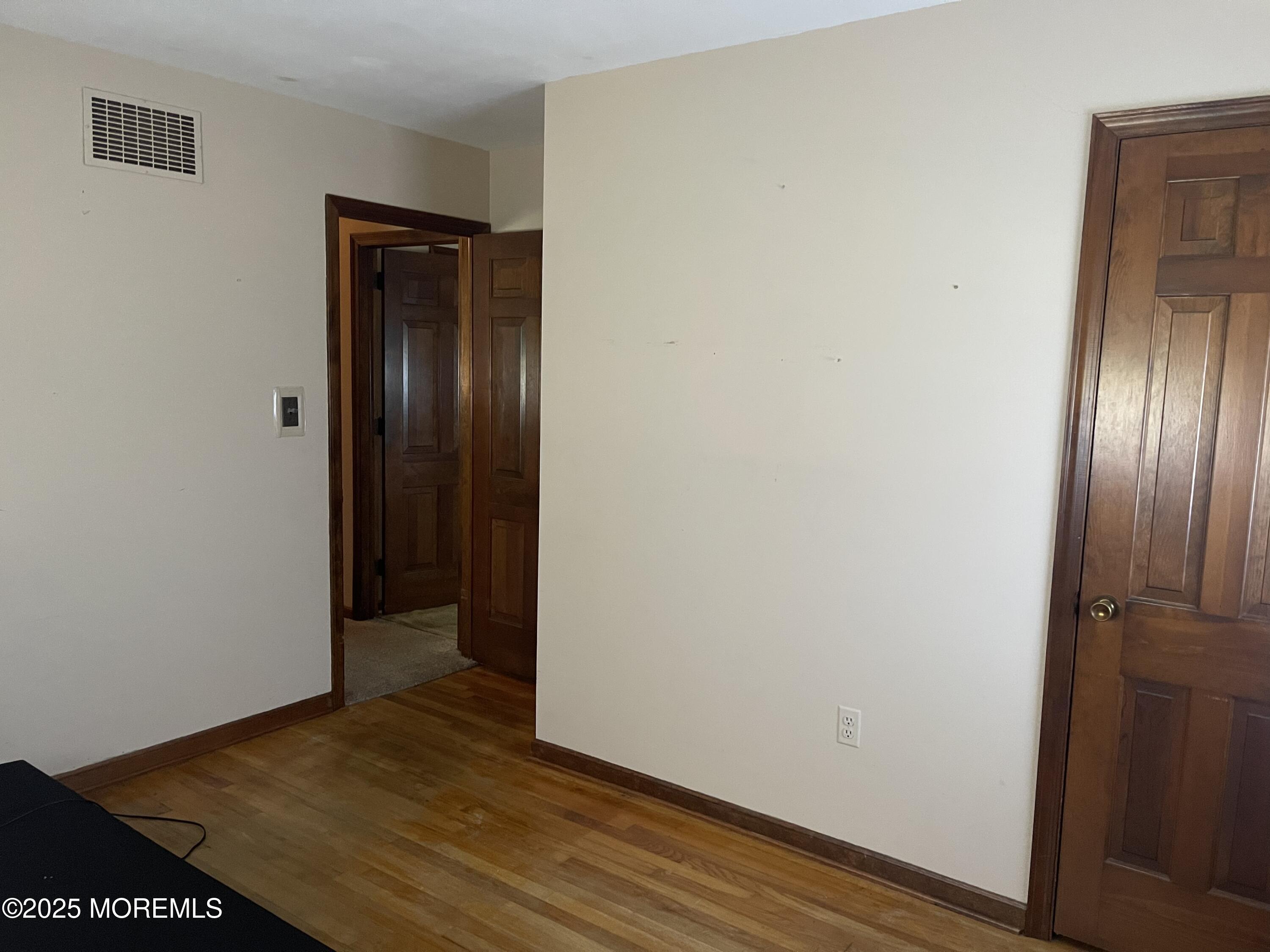 2023 Lanes Mill Road Brick, NJ 08724 - Photo 30 of 40 a view of empty room with wooden floor