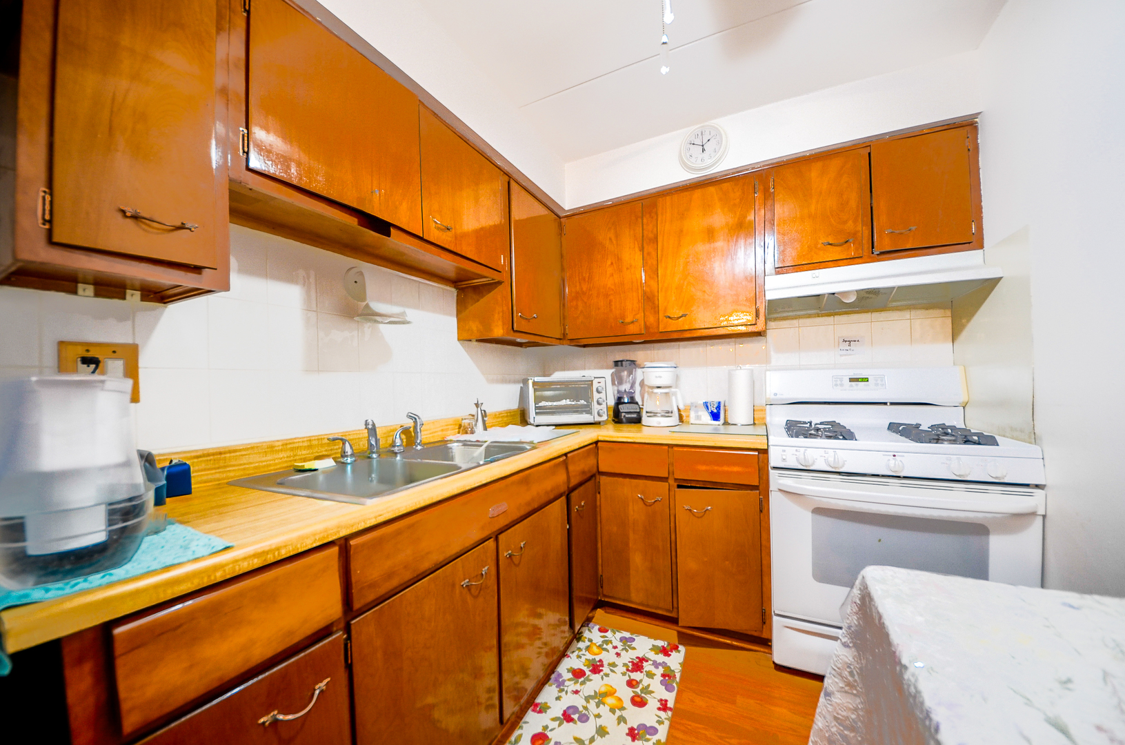 2521 Thatcher Avenue, Unit 2D River Grove, IL 60171 - Photo 5 of 10 a kitchen with a sink cabinets and appliances