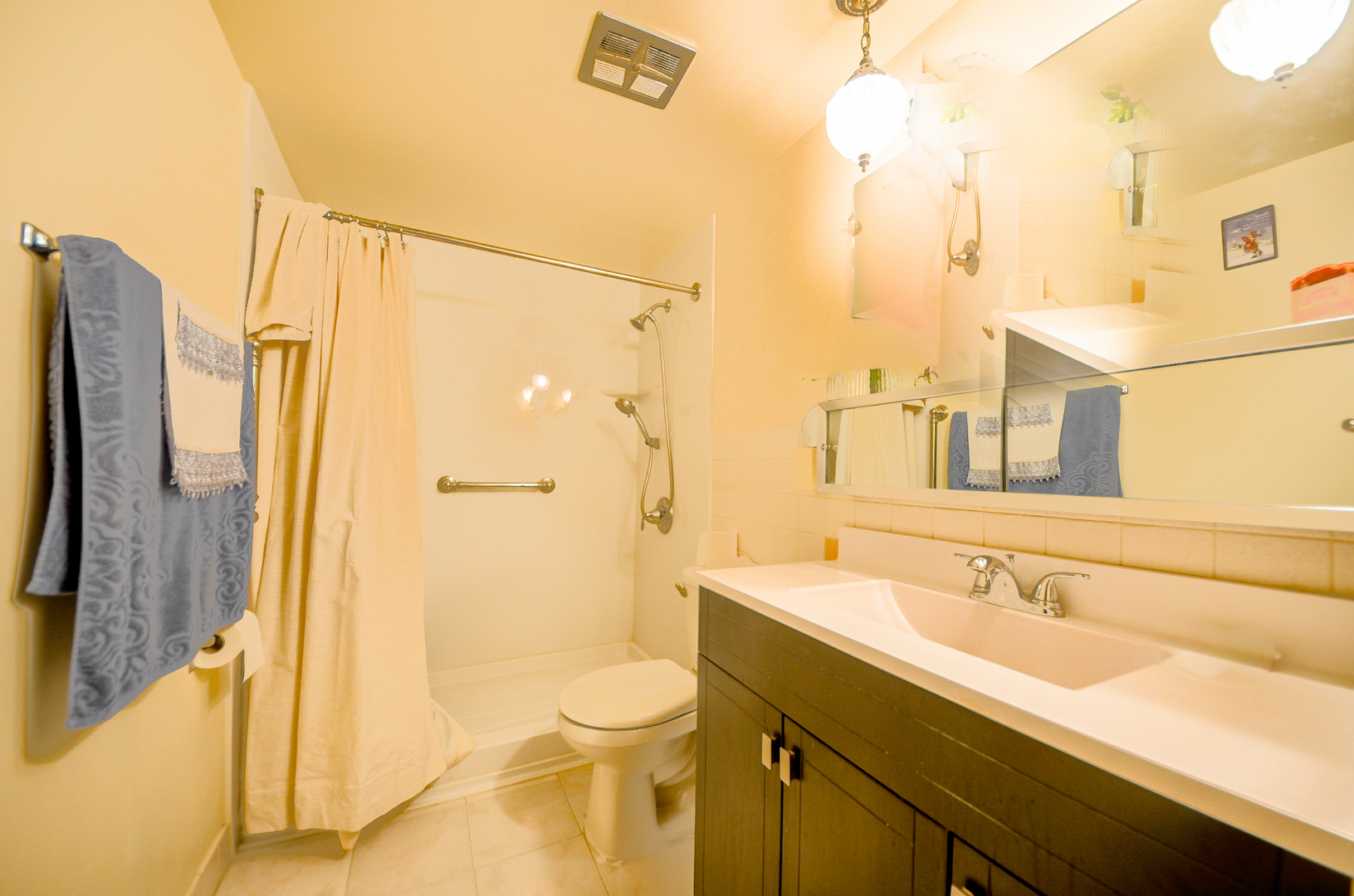 2521 Thatcher Avenue, Unit 2D River Grove, IL 60171 - Photo 9 of 10 a bathroom with a sink a toilet and shower