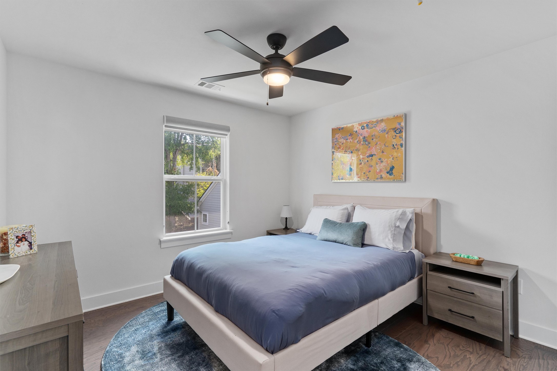 1309 Fort Branch Boulevard Austin, TX 78721 - Photo 12 of 19 a bedroom with a bed and window