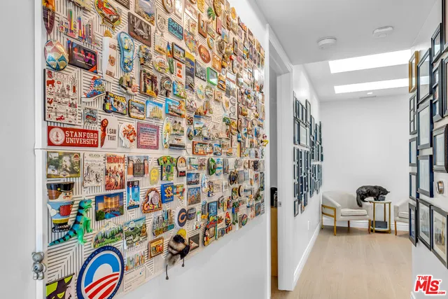 a large bedroom with a bed and a large window