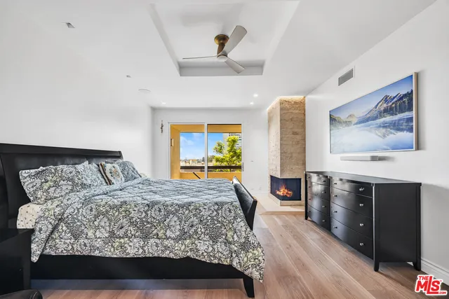 a view of swimming pool with outdoor seating and plants