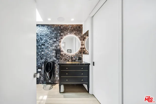 a dining room with furniture a chandelier and a floor to ceiling window
