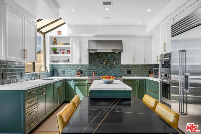 a living room with lots of furniture and white walls