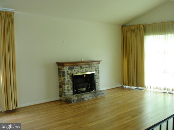 3327 Northmont Road Baltimore, MD 21244 - Photo 14 of 19 Hardwood, wall of windows, fireplace