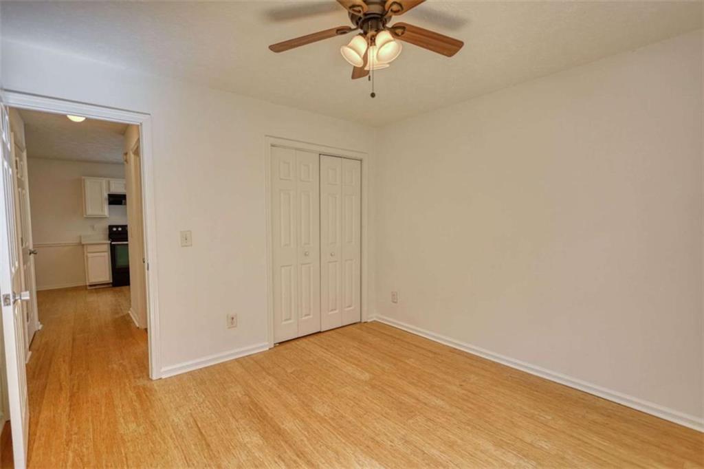 5185 Tew Lane Southwest Covington, GA 30014 - Photo 11 of 42 a view of empty room with wooden floor