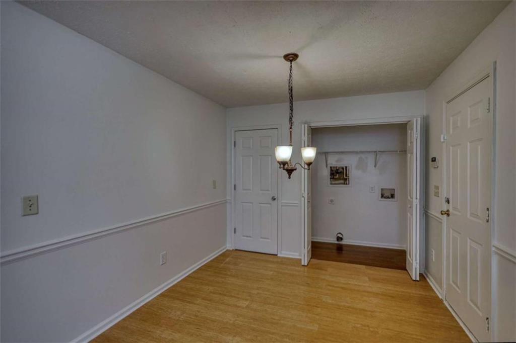 5185 Tew Lane Southwest Covington, GA 30014 - Photo 18 of 42 a view of an empty room with a chandelier