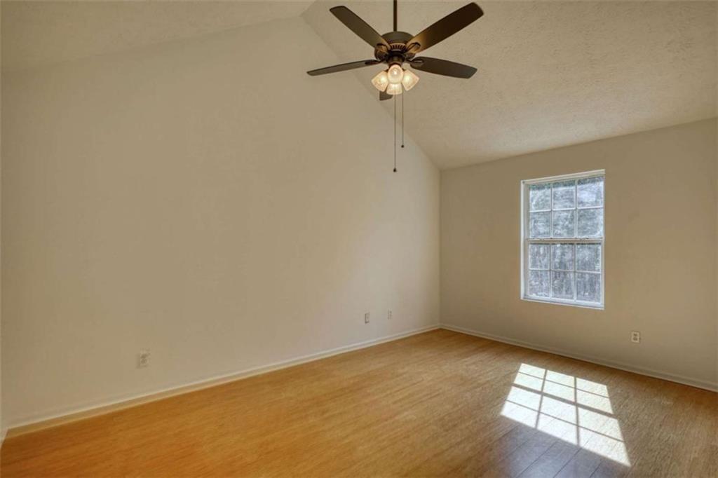 5185 Tew Lane Southwest Covington, GA 30014 - Photo 22 of 42 an empty room with a window and a fan