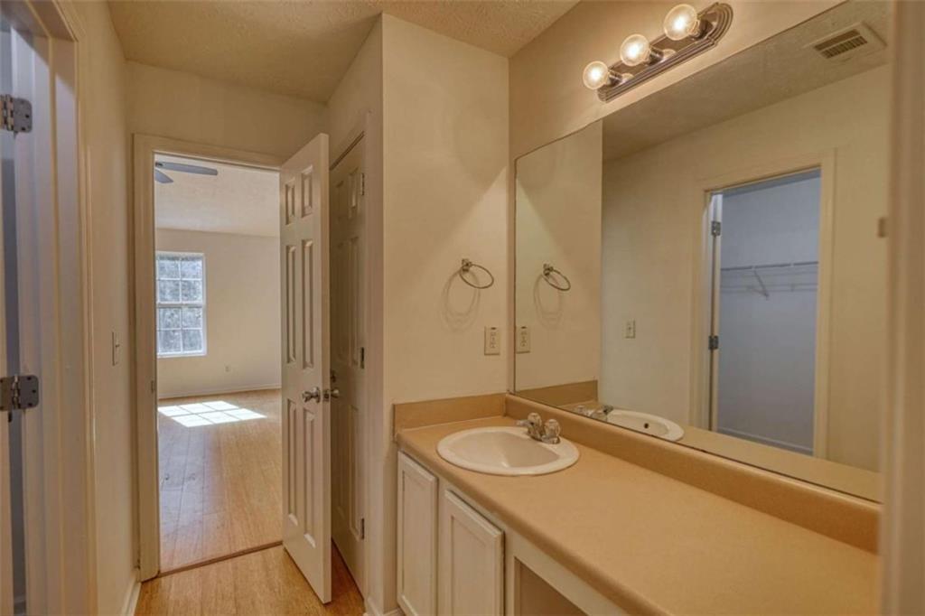 5185 Tew Lane Southwest Covington, GA 30014 - Photo 26 of 42 a bathroom with a sink and a mirror