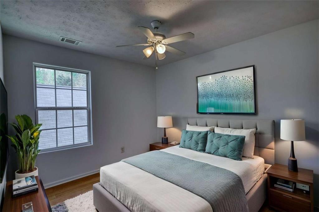 5185 Tew Lane Southwest Covington, GA 30014 - Photo 28 of 42 a bedroom with bed and a flat screen tv