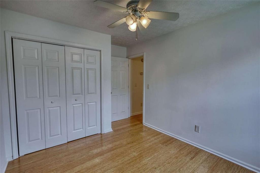 5185 Tew Lane Southwest Covington, GA 30014 - Photo 31 of 42 a view of empty room with wooden floor