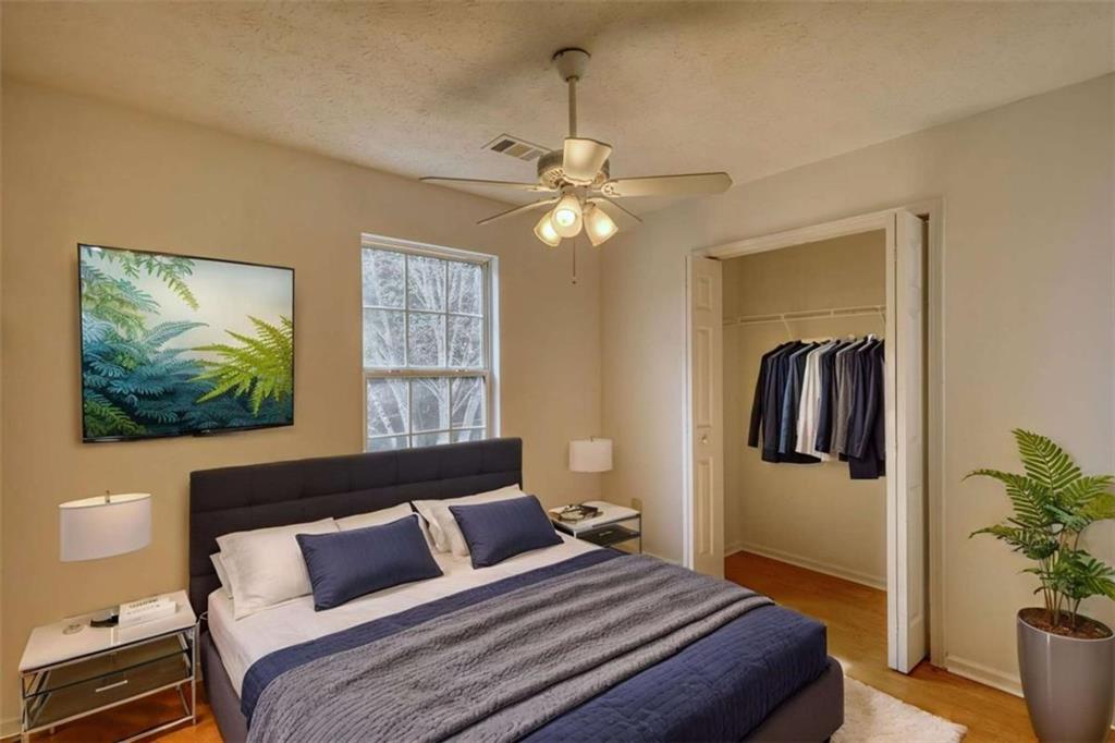 5185 Tew Lane Southwest Covington, GA 30014 - Photo 33 of 42 a bedroom with a bed and a painting on the wall