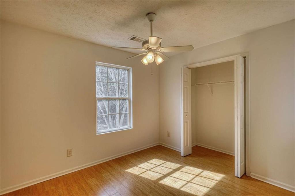 5185 Tew Lane Southwest Covington, GA 30014 - Photo 34 of 42 an empty room with windows and fan