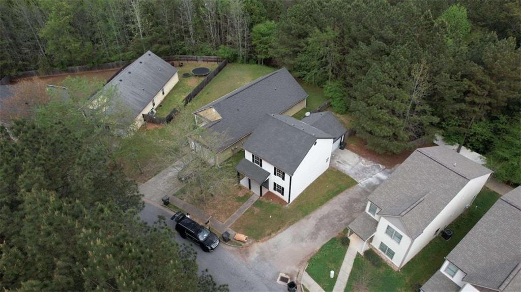 5185 Tew Lane Southwest Covington, GA 30014 - Photo 39 of 42 an aerial view of a house with a yard and trees