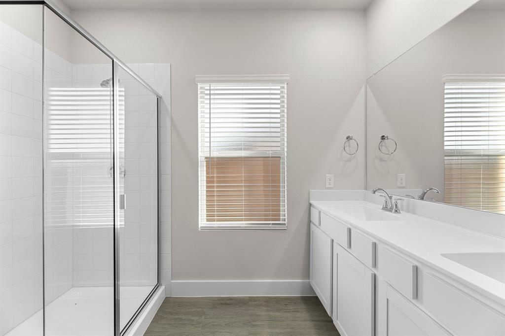 2372 Bell Way Forney, TX 75126 - Photo 21 of 39 a bathroom with a sink a vanity and a mirror