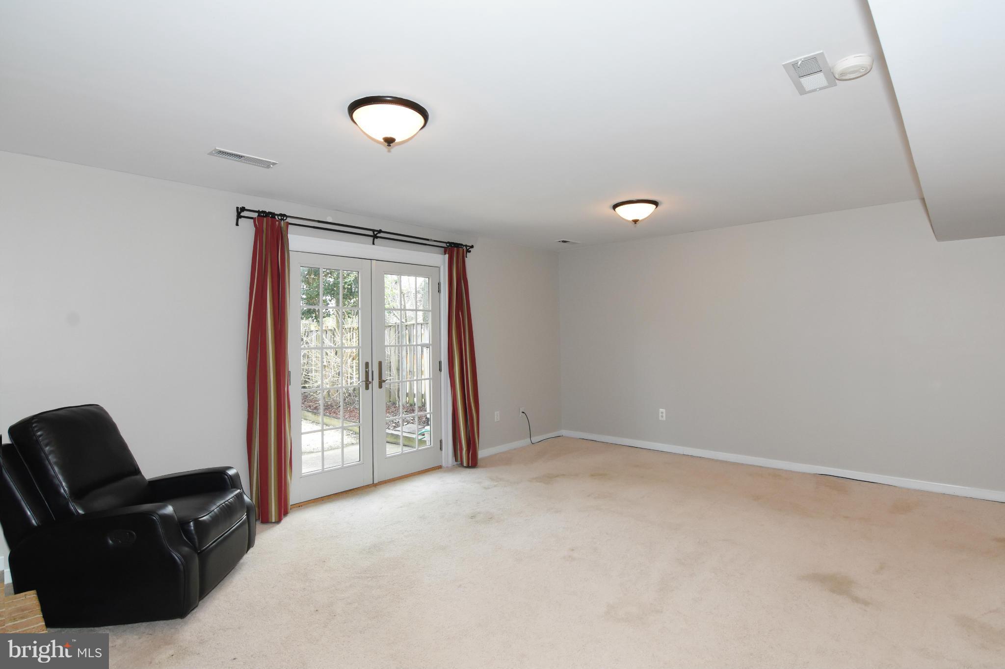 497 Colonial Ridge Lane Arnold, MD 21012 - Photo 21 of 30 Basement with Sliders to Patio