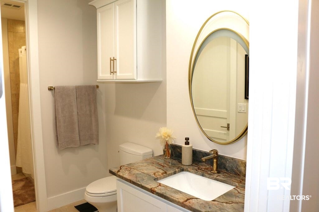18269 Colony Drive, Unit 803 Fairhope, AL 36532 - Photo 17 of 27 Bathroom with a shower with shower curtain and vanity