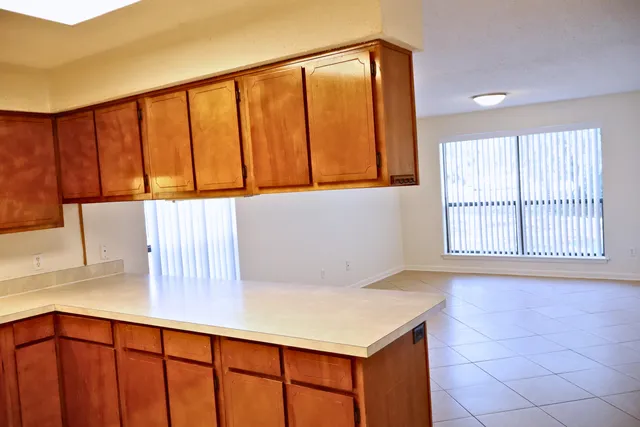 a view of an empty room with windows