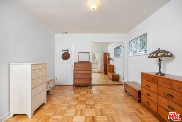 a room with furniture and wooden floor