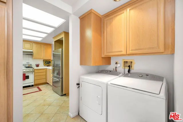 a view of a patio with a table and chairs under an umbrella