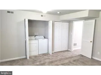 a kitchen with a sink and a vanity