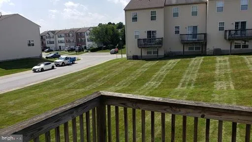 a balcony with table and chairs