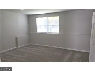 a room with a window and a table