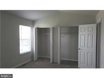 a black and white photo of a living room