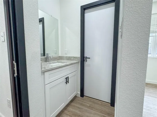 a bathroom with a sink and a mirror