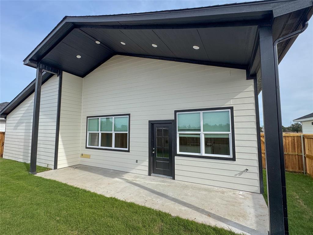 440 Lucy Road Greenville, TX 75402 - Photo 18 of 19 a black and white building with a large window