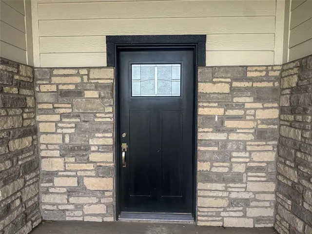 a front view of a house with a door