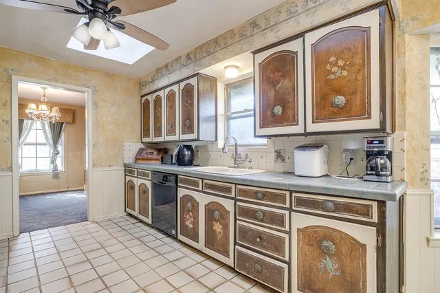 a kitchen with stainless steel appliances granite countertop a stove and a sink