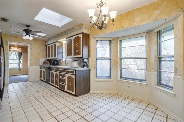 a kitchen with stainless steel appliances granite countertop a stove and a sink