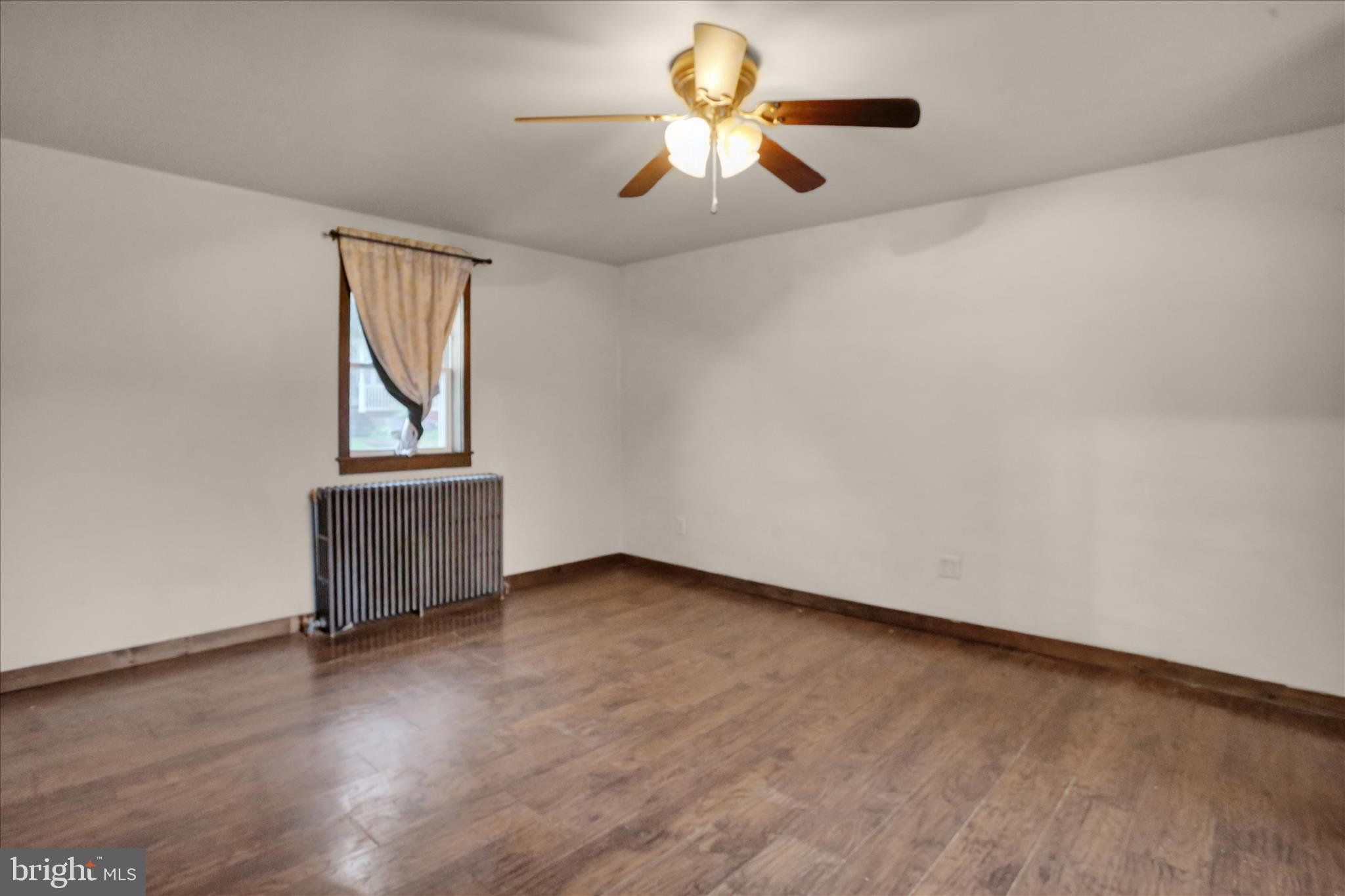 1039 Long Run Road Pine Grove, PA 17963 - Photo 11 of 34 an empty room with windows and chandelier fan