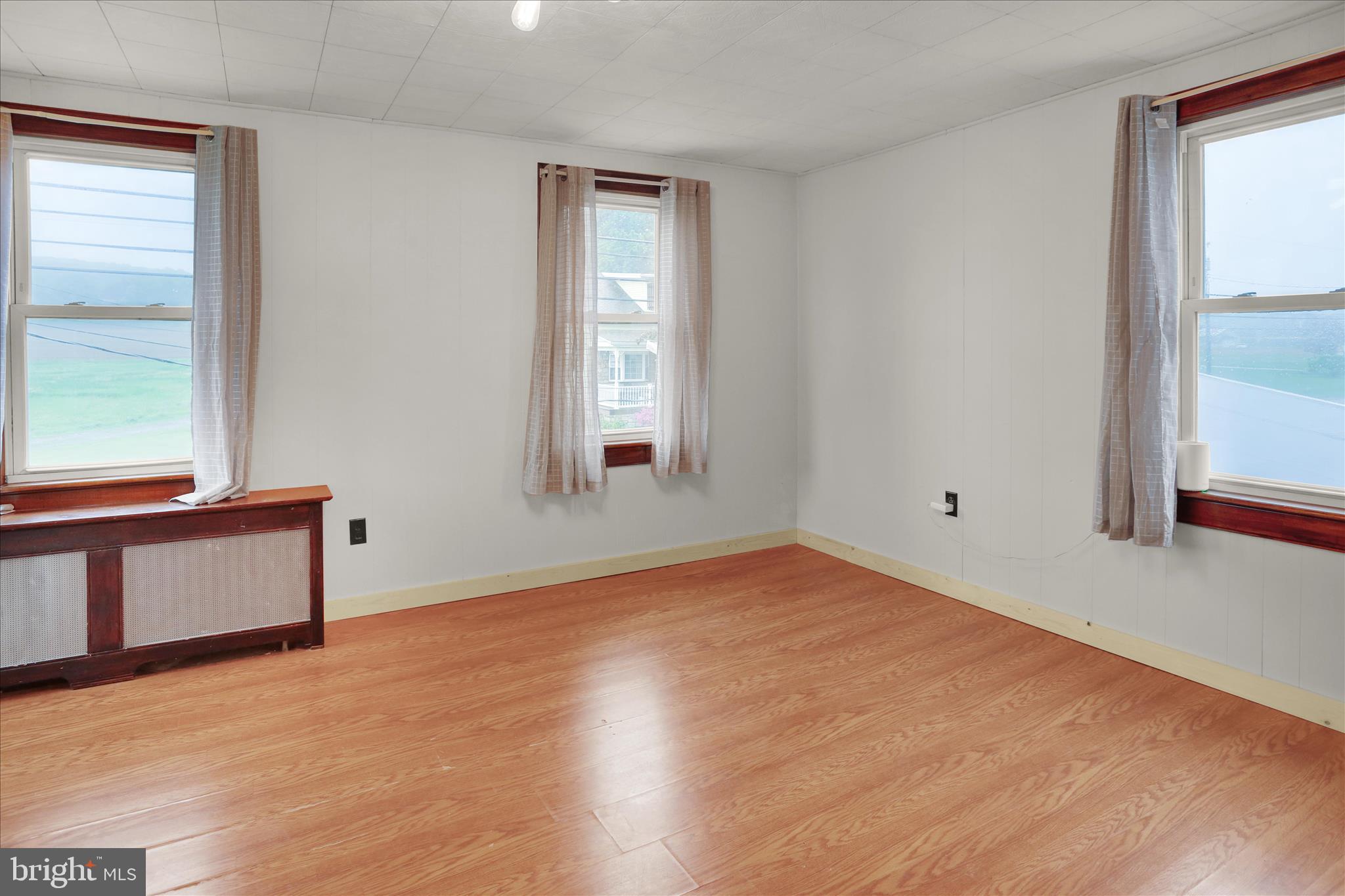 1039 Long Run Road Pine Grove, PA 17963 - Photo 14 of 34 a view of an empty room with wooden floor and a window