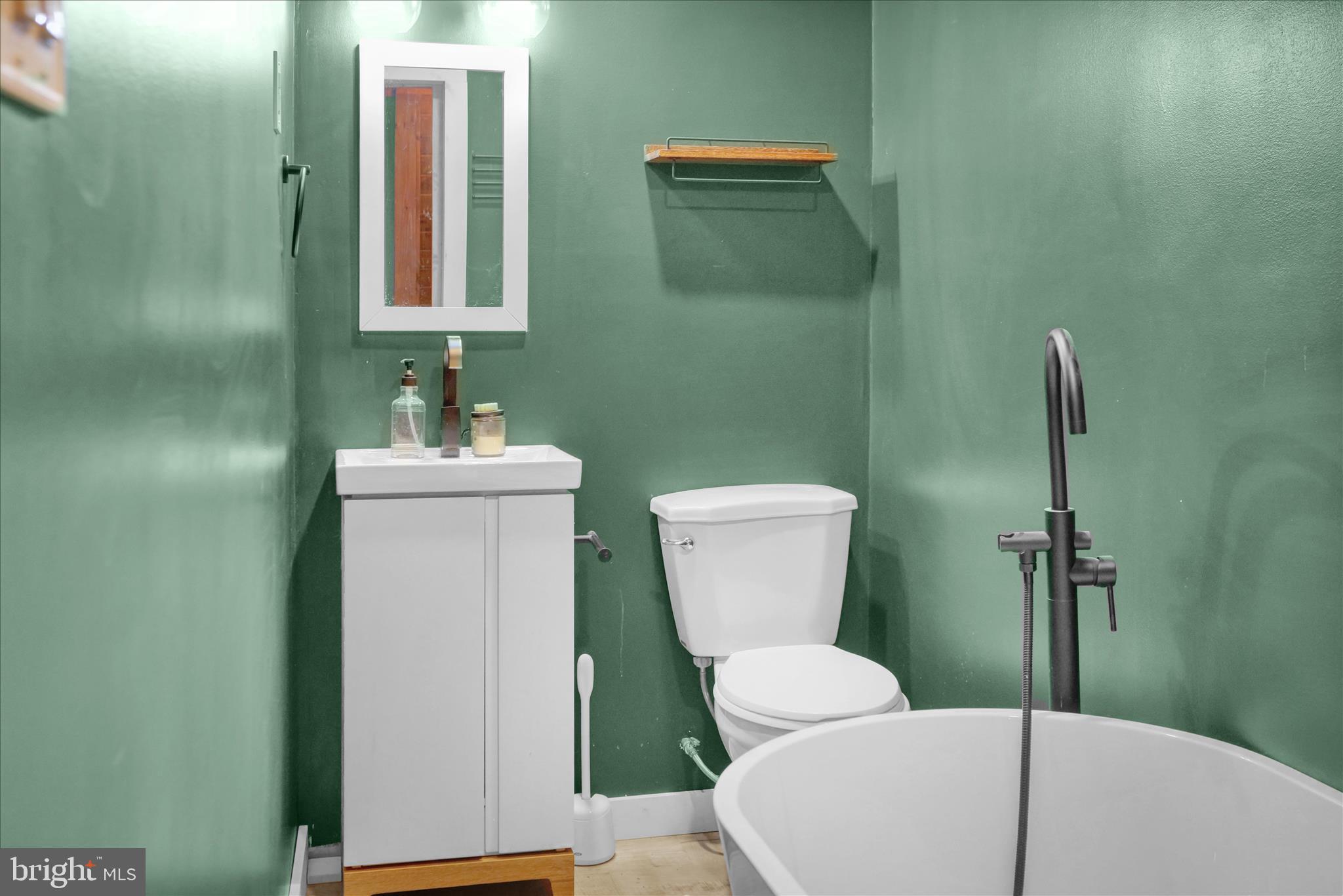 1039 Long Run Road Pine Grove, PA 17963 - Photo 19 of 34 a bathroom with a toilet sink and mirror