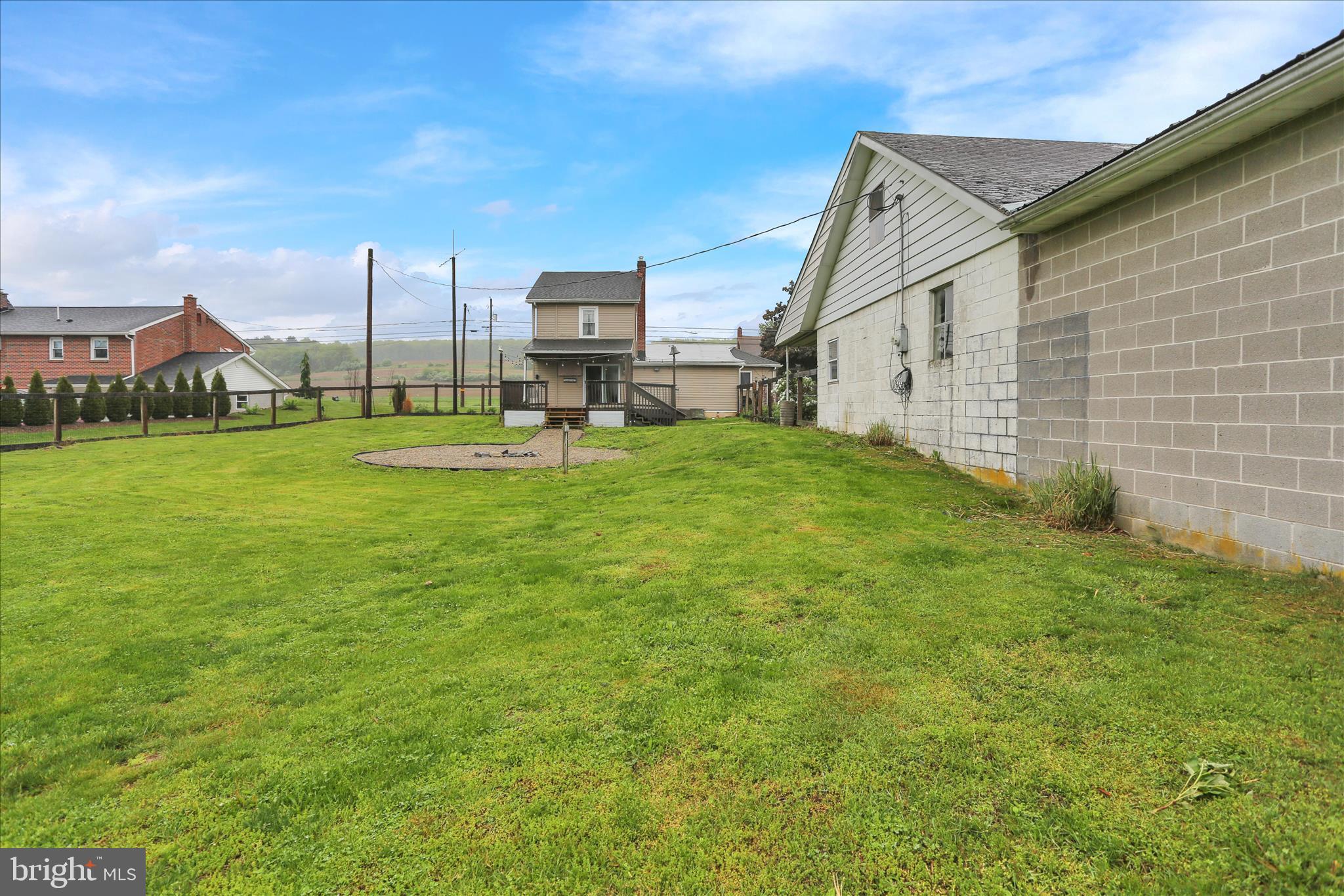 1039 Long Run Road Pine Grove, PA 17963 - Photo 22 of 34 a view of a big house with a big yard and palm trees