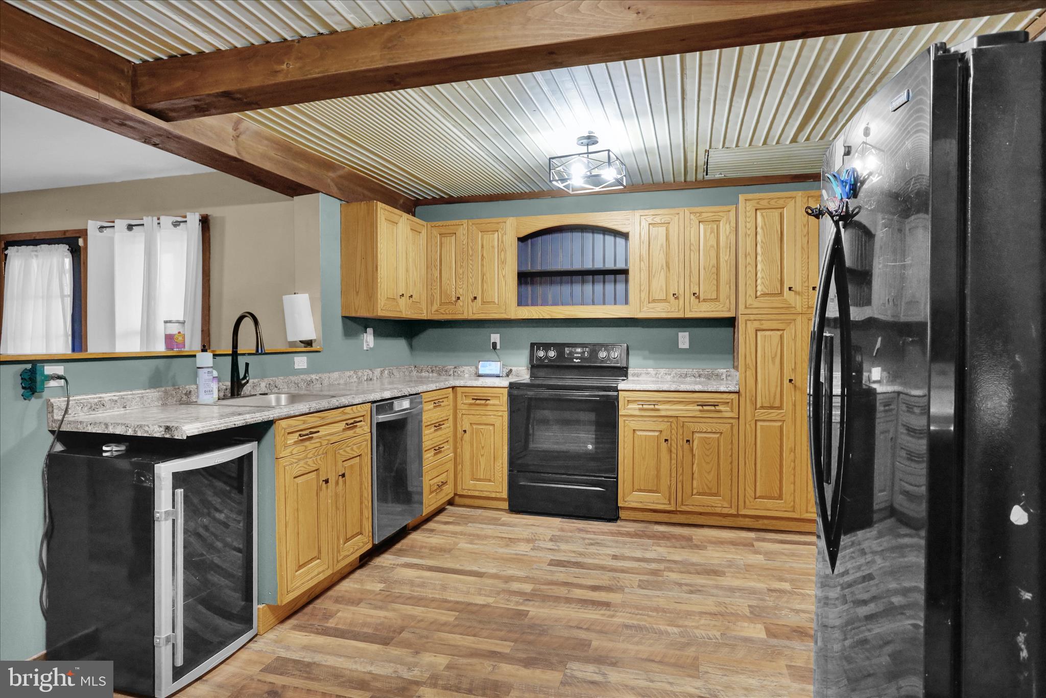 1039 Long Run Road Pine Grove, PA 17963 - Photo 8 of 34 a kitchen with stainless steel appliances granite countertop a sink a stove and a refrigerator