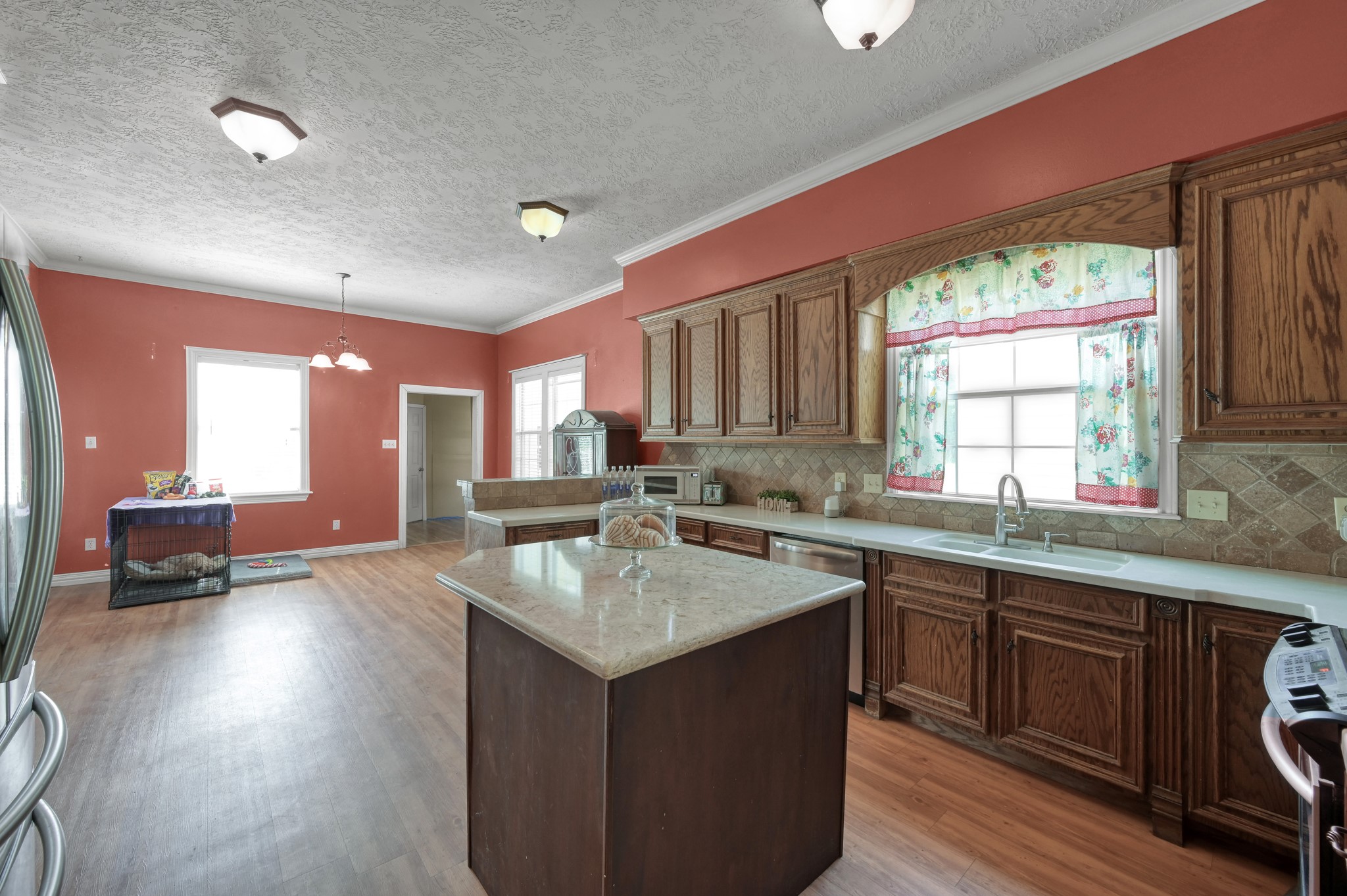 144 Wood Farm Road Huntsville, TX 77320 - Photo 10 of 35 a kitchen with a sink stove and cabinets