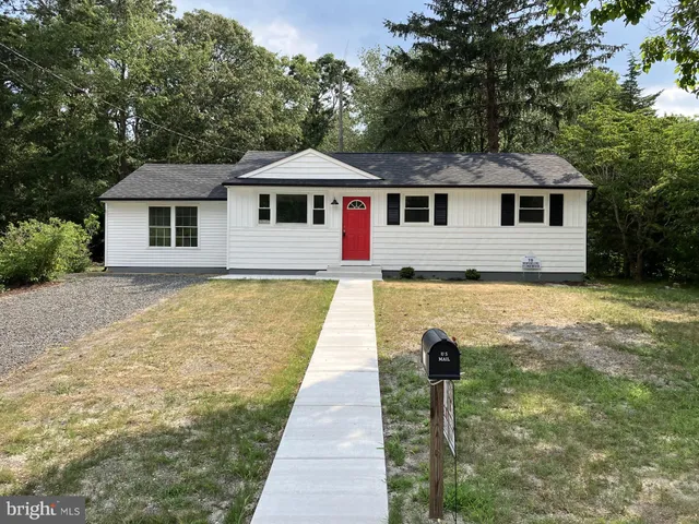 a front view of a house with yard