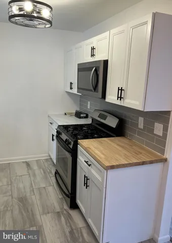 a kitchen with a stove and a sink