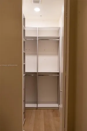 a view of an empty walk in closet