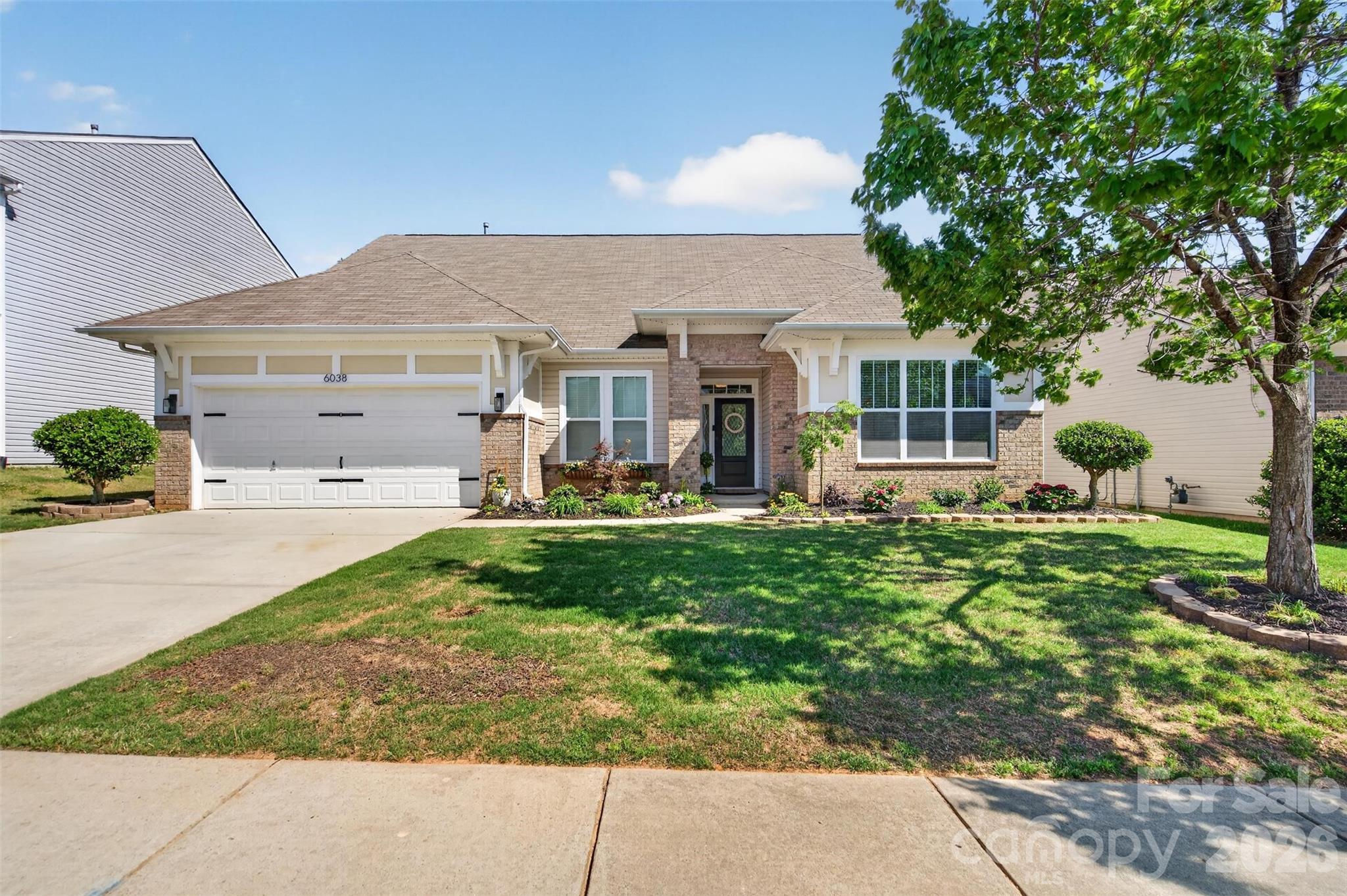 front view of a house with a yard